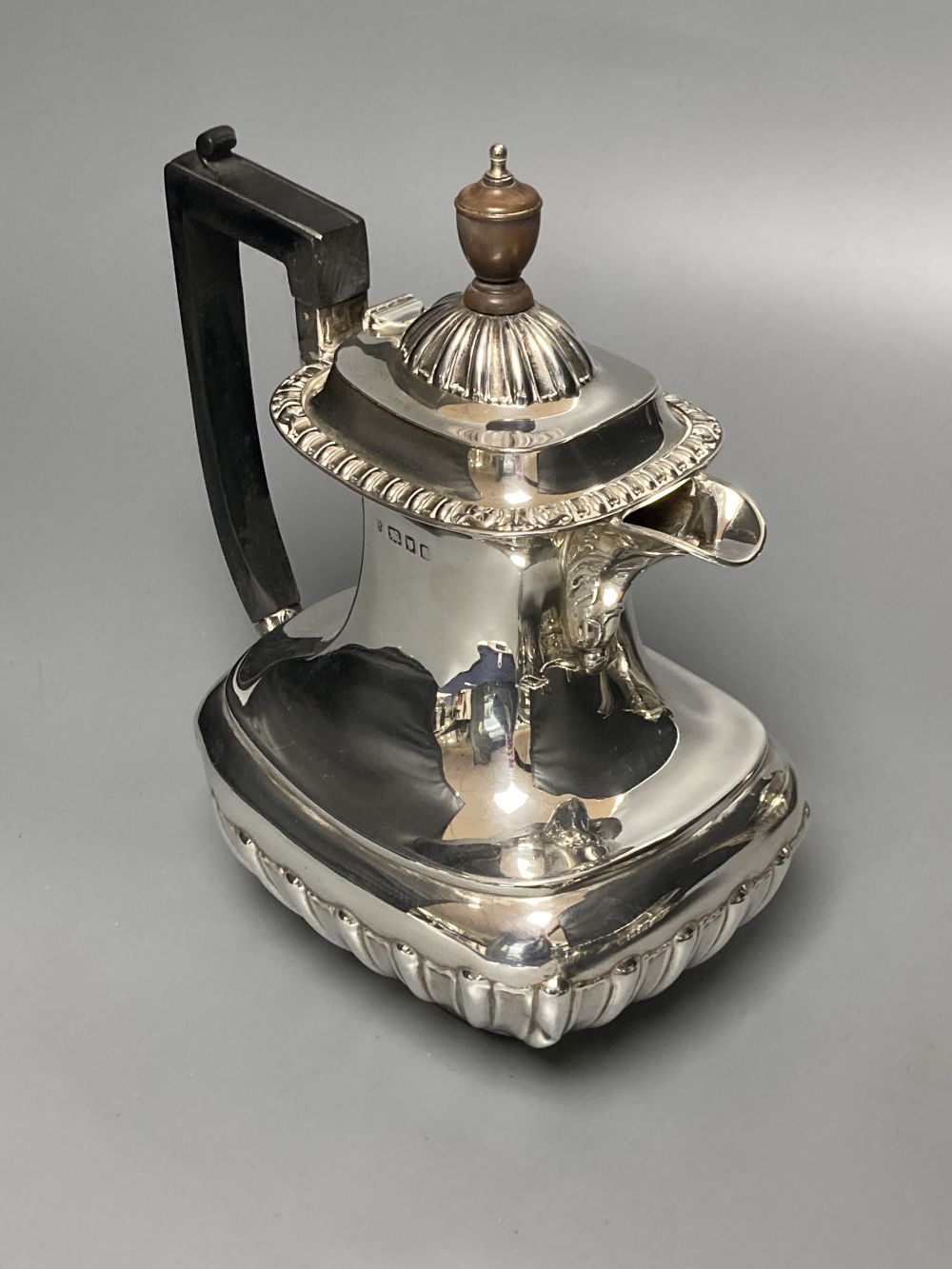 A George V demi fluted silver four piece tea set by Charles Boyton & Son Ltd, London 1918 and 1922,